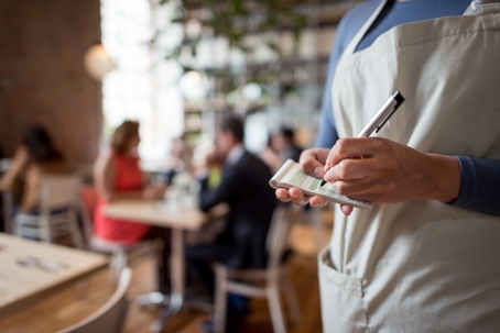 waitress writing down an order