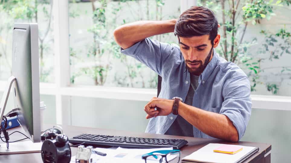 man looking at watch